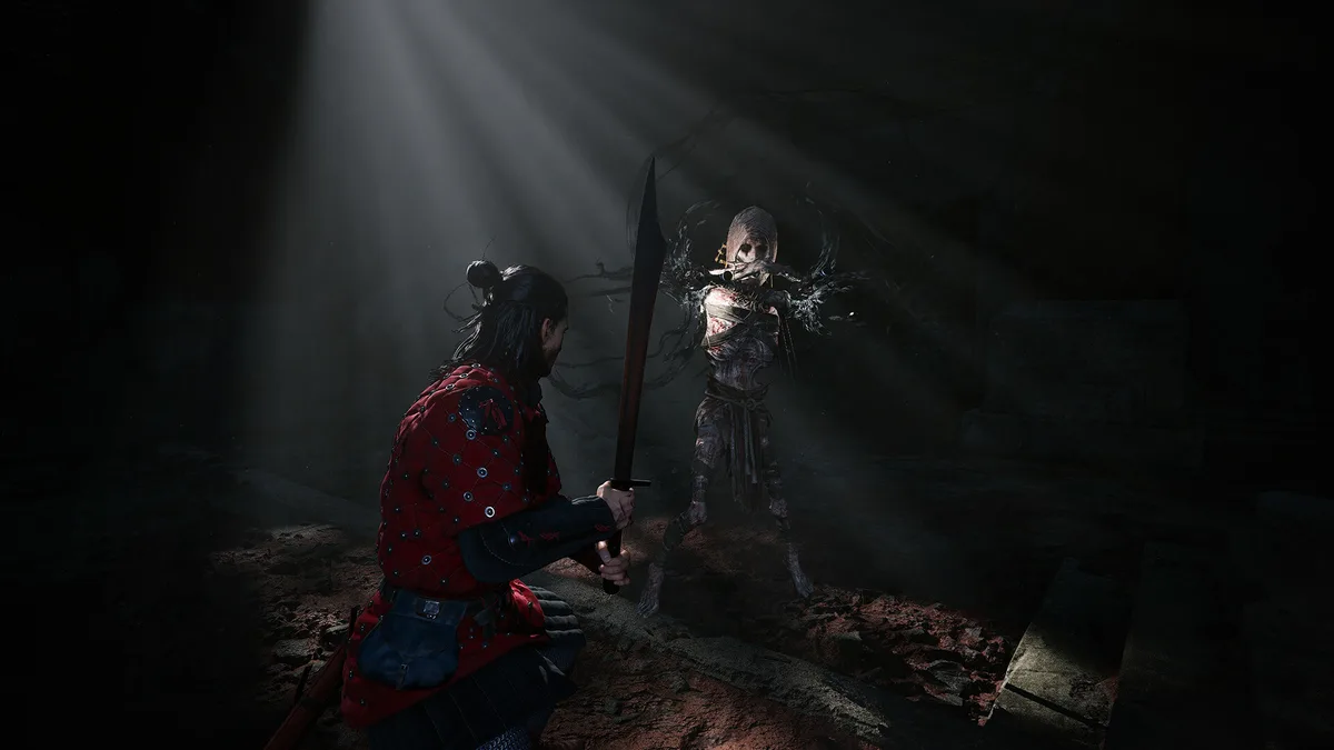Coen battling Bakir in a dark dungeon fight in The Blood of Dawnwalker