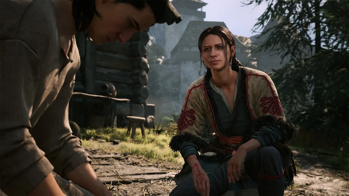 Coen talking with a villager at a mountain cabin in The Blood of Dawnwalker